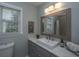 Bathroom featuring modern sink, updated countertop, and a framed mirror at 204 Foxborough Rd, Goose Creek, SC 29445