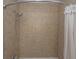 Shower detail highlighting neutral tile and updated shower head at 204 Foxborough Rd, Goose Creek, SC 29445
