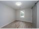 A bedroom with wood-look flooring, a barn door, neutral paint and a window that lets in natural light at 204 Foxborough Rd, Goose Creek, SC 29445