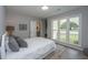 Inviting bedroom with a large window and a comfortable bed with stylish pillows at 204 Foxborough Rd, Goose Creek, SC 29445