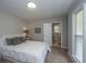 Comfortable bedroom with view of the en-suite bath, natural light and hardwood floors at 204 Foxborough Rd, Goose Creek, SC 29445