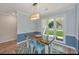 Cozy dining area with a rustic wooden table, a lovely chandelier, and chic design elements creating a warm setting at 204 Foxborough Rd, Goose Creek, SC 29445