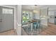 Charming dining area features a rustic wood table, stylish decor, and great natural light to enjoy your meals at 204 Foxborough Rd, Goose Creek, SC 29445