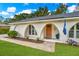 Charming home with a cozy entrance and an inviting orange front door, with a lush green lawn at 204 Foxborough Rd, Goose Creek, SC 29445