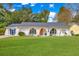 A beautifully maintained home with a lush lawn and a unique, arched window design adding curb appeal at 204 Foxborough Rd, Goose Creek, SC 29445