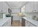 Well-lit kitchen showcasing ample counter space, stainless steel appliances, and modern finishes at 204 Foxborough Rd, Goose Creek, SC 29445