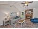 Cozy living room features a brick fireplace, beamed ceiling, and comfortable seating creating an inviting space at 204 Foxborough Rd, Goose Creek, SC 29445