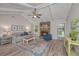 Bright and airy living room with a cozy fireplace, wood-look floors, and tasteful decor for a relaxed atmosphere at 204 Foxborough Rd, Goose Creek, SC 29445