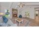 Inviting living room with a brick fireplace, vaulted ceiling, and ample natural light for a relaxing ambiance at 204 Foxborough Rd, Goose Creek, SC 29445