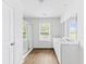 Bright bathroom featuring a double vanity, a glass door shower, and a window at 217 Black Tupelo Ct, Moncks Corner, SC 29461