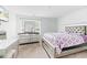 Comfortable bedroom featuring a grey bedframe, dresser and a window for natural lighting at 217 Black Tupelo Ct, Moncks Corner, SC 29461