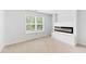 Bright bedroom with modern fireplace and large window for natural lighting at 217 Black Tupelo Ct, Moncks Corner, SC 29461