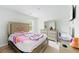 Bright bedroom featuring a beige bed frame with a headboard and dresser set at 217 Black Tupelo Ct, Moncks Corner, SC 29461