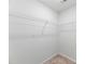 Walk in closet features white wire shelving at 217 Black Tupelo Ct, Moncks Corner, SC 29461