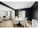 Stylish dining area with modern table and chairs, adjacent to the living room at 217 Black Tupelo Ct, Moncks Corner, SC 29461