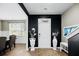 Stylish entryway with black accent wall, light wood floors, and decorative accents at 217 Black Tupelo Ct, Moncks Corner, SC 29461