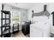 The laundry room has appliances and a large window for natural light at 217 Black Tupelo Ct, Moncks Corner, SC 29461