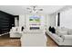 Bright living room with a built-in entertainment center and comfortable seating at 217 Black Tupelo Ct, Moncks Corner, SC 29461