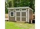 Exterior view of a shed with neutral colored paint and white trim at 217 Black Tupelo Ct, Moncks Corner, SC 29461