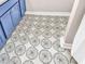 Eye-catching bathroom floor featuring a decorative circular pattern, with blue vanity in view at 2226 Arthur Rose Ln, Johns Island, SC 29455