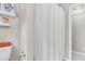Fresh bathroom with white shower curtain, white walls and shelving at 2226 Arthur Rose Ln, Johns Island, SC 29455