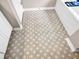 Neutral bathroom floor with a unique patterned tile at 2226 Arthur Rose Ln, Johns Island, SC 29455