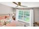 Bedroom features large window with wooded backyard view at 2226 Arthur Rose Ln, Johns Island, SC 29455