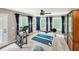 Spacious bonus room with multiple windows, exercise equipment, and a ceiling fan at 2226 Arthur Rose Ln, Johns Island, SC 29455