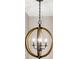 Close up of a wood and metal rounded chandelier in a modern design at 2226 Arthur Rose Ln, Johns Island, SC 29455