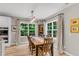 Inviting dining room featuring large windows with scenic views, a stylish chandelier, and comfortable seating at 2226 Arthur Rose Ln, Johns Island, SC 29455