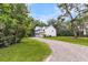 Beautiful two-story home with a long driveway, lush landscaping, and a serene setting at 2226 Arthur Rose Ln, Johns Island, SC 29455