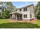 Rear exterior of the home with a screened in porch overlooking the yard, creating an inviting outdoor space at 2226 Arthur Rose Ln, Johns Island, SC 29455