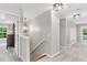 Upstairs hallway with carpet, hanging chandelier, and bright, natural lighting at 2226 Arthur Rose Ln, Johns Island, SC 29455
