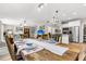 Open-concept layout seamlessly connects the kitchen, dining area, and living room creating an inviting atmosphere at 2226 Arthur Rose Ln, Johns Island, SC 29455