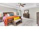 Bright main bedroom featuring a tray ceiling, ceiling fan, and furniture at 2226 Arthur Rose Ln, Johns Island, SC 29455