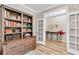 Office view showcases a custom bookshelf and open doorway leading to another room at 2226 Arthur Rose Ln, Johns Island, SC 29455