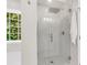 Modern glass shower with tile surround and rain shower head at 2226 Arthur Rose Ln, Johns Island, SC 29455