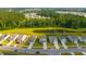 Beautiful aerial view of homes in a community with a lake and lush green trees at 225 N Light Way, Summerville, SC 29486