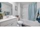 Clean bathroom featuring a shower-tub combo with blue shower curtain, and a white sink vanity at 225 N Light Way, Summerville, SC 29486