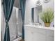 Bright bathroom with a glass enclosed shower and contemporary fixtures at 225 N Light Way, Summerville, SC 29486