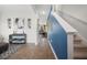 Bright hallway with wooden floors, leading to a living area with a glimpse of the backyard at 225 N Light Way, Summerville, SC 29486
