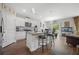 Modern kitchen with white cabinets, granite countertops, stainless steel appliances, and bar stool seating at 225 N Light Way, Summerville, SC 29486