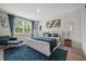 Bright main bedroom with a plush rug, and a large window with a backyard view at 225 N Light Way, Summerville, SC 29486