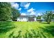 Large, well-maintained backyard featuring a screened porch and plenty of open space at 229 Lindy Creek Rd, Goose Creek, SC 29445