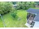 Spacious backyard with lush green lawn and a screened porch, ideal for outdoor entertaining and relaxation at 229 Lindy Creek Rd, Goose Creek, SC 29445