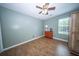 Cozy bedroom showcasing hardwood floors and a window for natural light at 229 Lindy Creek Rd, Goose Creek, SC 29445