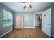 A cozy bedroom features a ceiling fan, wood floors, and a spacious closet at 229 Lindy Creek Rd, Goose Creek, SC 29445