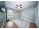 Bright bedroom showcasing hardwood floors, a ceiling fan, and natural light at 229 Lindy Creek Rd, Goose Creek, SC 29445