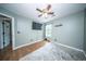 A bright bedroom featuring a ceiling fan and natural light from a window at 229 Lindy Creek Rd, Goose Creek, SC 29445