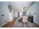 Charming dining area featuring wood floors, fireplace, and stylish furniture at 229 Lindy Creek Rd, Goose Creek, SC 29445